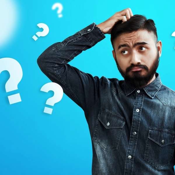 Man scratching head looking confused