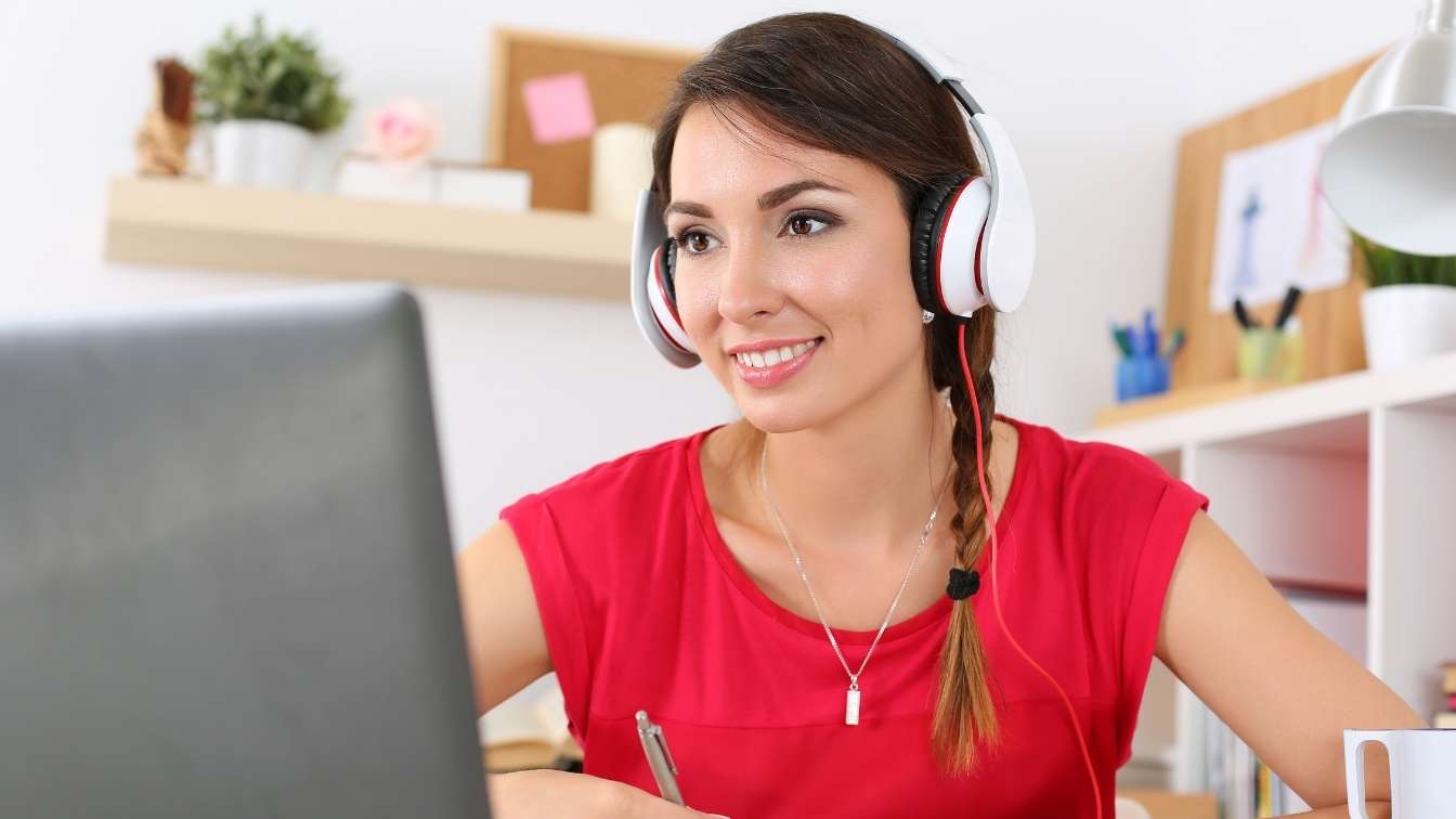 Woman at laptop taking an online seminar